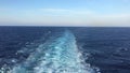 Sea water ship trail with white foamy wave.