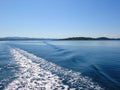 Sea water ship trail with white foamy wave. Tropical islands ferry travel. Bubble tail after cruise ship. Deep ocean view. Royalty Free Stock Photo