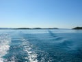 Sea water ship trail with white foamy wave. Tropical islands ferry travel. Bubble tail after cruise ship. Deep ocean view. Royalty Free Stock Photo