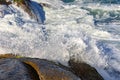 Sea water spray over the stones Royalty Free Stock Photo