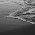 Sea water tide on the sand beach. Relax. Black and White shot