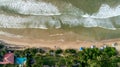 Sea water waves and resorts on beach Royalty Free Stock Photo