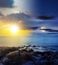 sea wave attacks the boulders of rocky shore with sun and moon at twilight Royalty Free Stock Photo