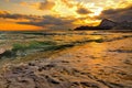 Sea wave on the beach, the surf on the Black sea coast at sunset. Royalty Free Stock Photo