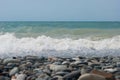 The Sea Wave of the Black Sea is a pebble beach. Smooth horizon, blue sky