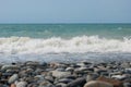 The Sea Wave of the Black Sea is a pebble beach. Smooth horizon, blue sky