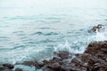 Sea wave breaking with rocky beach, Holiday and relax time concept, selective focus Royalty Free Stock Photo