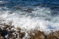 Sea wave breaks on a rocky shore