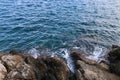 The sea wave crashes against the stones on the shore Royalty Free Stock Photo