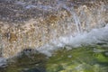 The sea wave crashing on the rock and make the splashing water and white air foam bubble. Royalty Free Stock Photo