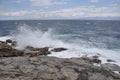 The sea wave crashing on the rock and make the splashing water and white air foam bubble. Royalty Free Stock Photo