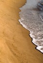 Sea wave on a deserted sandy beach. Sea surf. Royalty Free Stock Photo