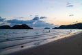 Sea wave moving to the beach with green islands and blue, yellow sky in background at the evening in Koh Mak Island at TraÃ Â¸Â°.