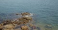 Sea wave over stone beach