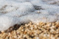 Sea wave rolling over the pebbles