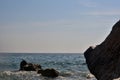 Sea wave splash on rocky beach. Ocean waves breaking on rocks. Royalty Free Stock Photo