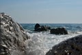 Sea wave splash on rocky beach. Ocean waves breaking on rocks. Royalty Free Stock Photo