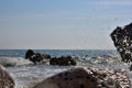 Sea wave splash on rocky beach. Ocean waves breaking on rocks. Royalty Free Stock Photo