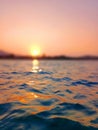 Sea wave splash, sunset, ocean water surf, sunrise, tropical island beach dawn, sun reflection, summer holidays, vacation