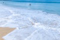 The sea wave splay white foam on the beach Royalty Free Stock Photo