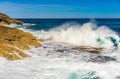 Sea wave, white water foam sea waves hitting against rocks Royalty Free Stock Photo