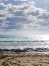 The sea, with waves on the background of blue sky and clouds Royalty Free Stock Photo