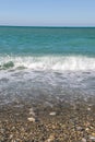 Sea waves on the beach. Selective focus. Summer nature background. vertical photo Royalty Free Stock Photo