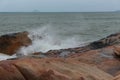 Sea waves beat against rocks and rocks