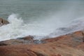 Sea waves beat against rocks and rocks