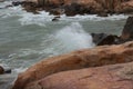 Sea waves beat against rocks and rocks