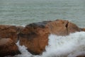 Sea waves beat against rocks and rocks