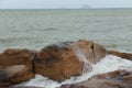Sea waves beat against rocks and rocks