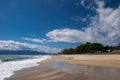 Sea waves on beautiful paradise sandy beach, blue summer sky with white clouds. Royalty Free Stock Photo