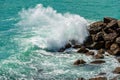 Sea waves break on the rocks - Breakwater in Liguria Italy Royalty Free Stock Photo