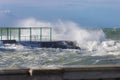 Sea Waves Breaking against Seashore Promenade in Windy Day: Stormy Weather Royalty Free Stock Photo