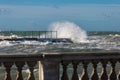 Sea Waves Breaking against Seashore Promenade in Windy Day: Stormy Weather Royalty Free Stock Photo