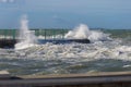 Sea Waves Breaking against Seashore Promenade in Windy Day: Stormy Weather Royalty Free Stock Photo