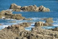 Sea waves coming to the rocks on the shore Royalty Free Stock Photo