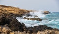 Sea waves crash onto rocks at Apostolos Andreas beach in Karpasia, Cyprus