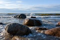 Sea waves crashing against the large granite stones Royalty Free Stock Photo