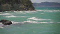 Sea waves crashing on a rock