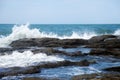 Sea waves crashing into rocks