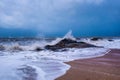 Sea waves crashing into the rocks in Kundapura Beach Royalty Free Stock Photo