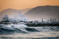 Sea waves crashing on a rocky pier in Marina di Massa Royalty Free Stock Photo