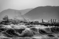 Sea waves crashing on a rocky pier in Marina di Massa Royalty Free Stock Photo
