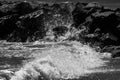 sea waves with foam and large stones. black and white beach photography Royalty Free Stock Photo