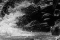 sea waves with foam and large stones. black and white beach photography Royalty Free Stock Photo