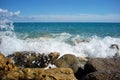 Sea waves hit stony seashore