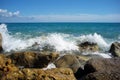 Sea waves hit stony seashore