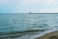 Sea waves at Odessa beach with lighthouse Royalty Free Stock Photo